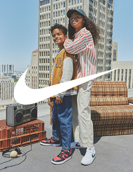 Happy kids on a roof with nike court sneakers