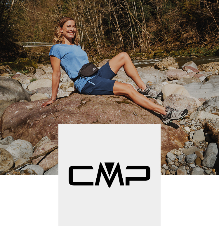 Woman in the forest on a rock with a CMP outfit