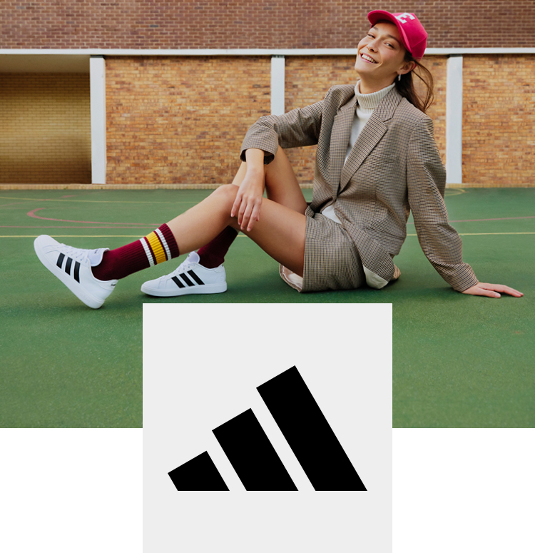Happy woman with adidas sneaker