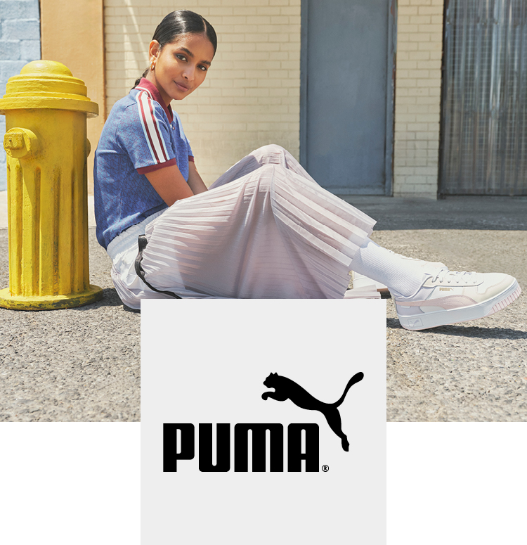 Woman at a water hydrant with Puma sneakers