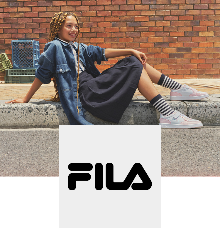 Happy girl chilling outside with fila court sneaker