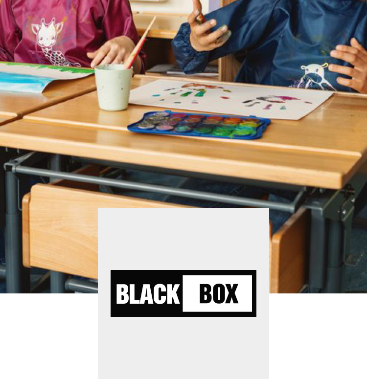 Kids painting with Black Box with painting aprons