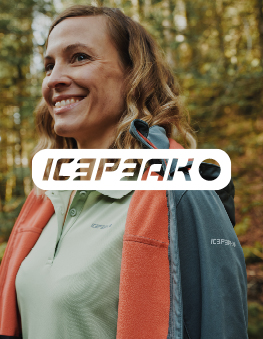 Happy woman outdoors with icepeak jacket