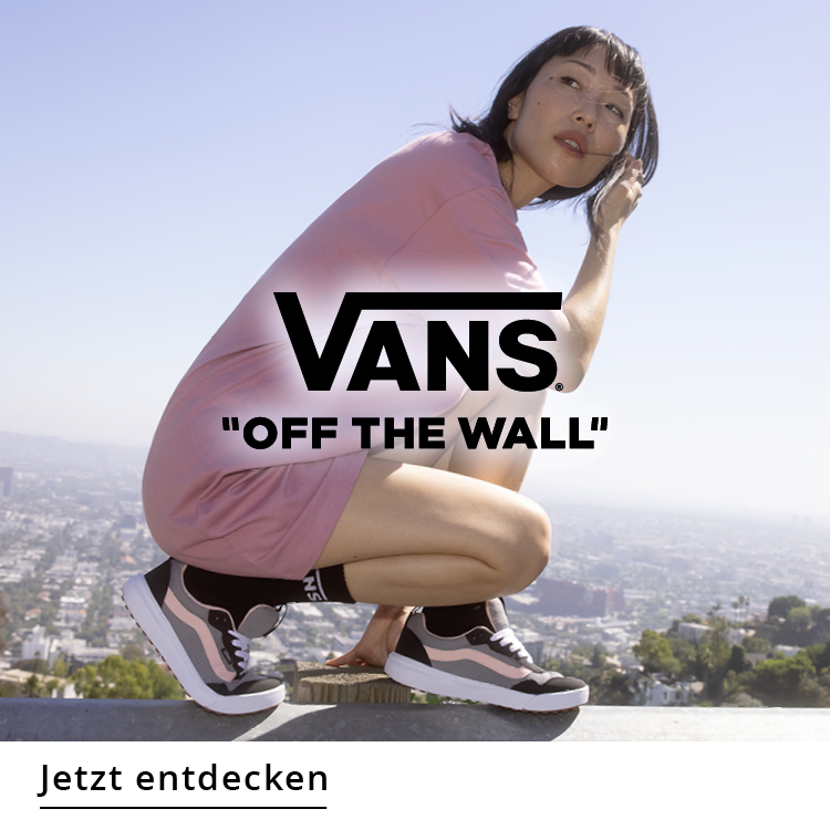 Woman wearing Vans in a sunny state on a wall