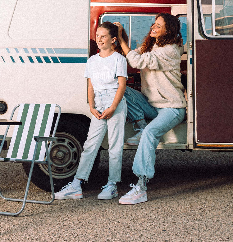 Woman and girl with puma sneaker in a van