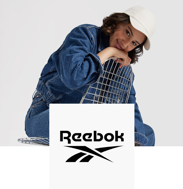Woman on a chair with Reebok sneaker
