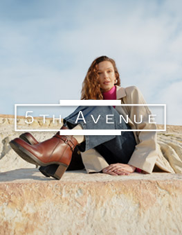 Woman with 50th Avenue Boots &amp; Logo
